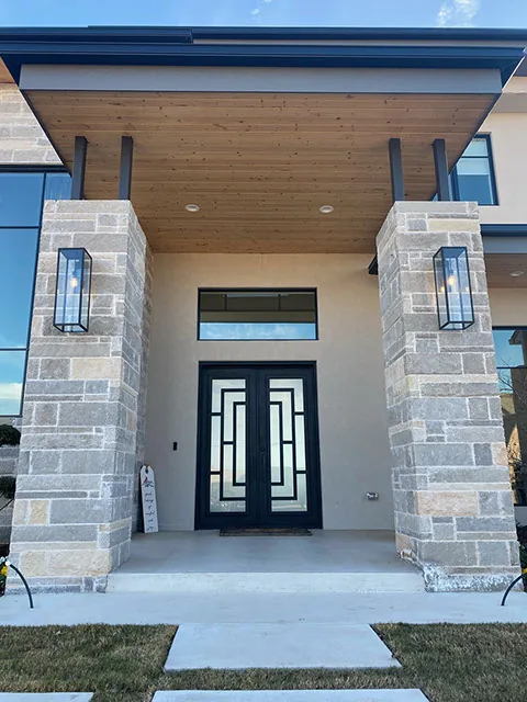 Arched iron door with transom